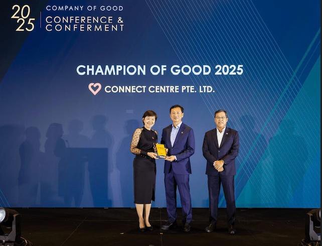 Connect Centre receiving the Champion of Good 2025 award on stage at the Company of Good Conference